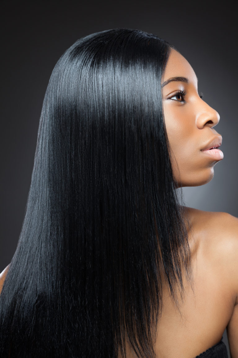Beautiful young black woman with long straight hair
